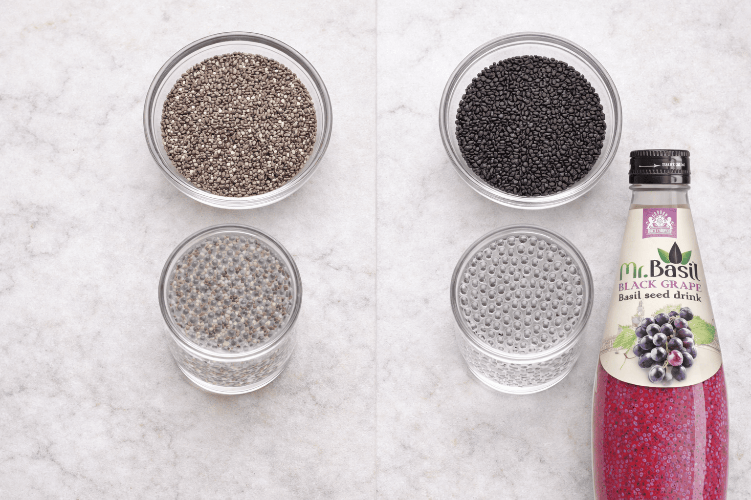 Side by side comparison of dry chia seeds and dry basil seeds in glass bowls on marble surface
