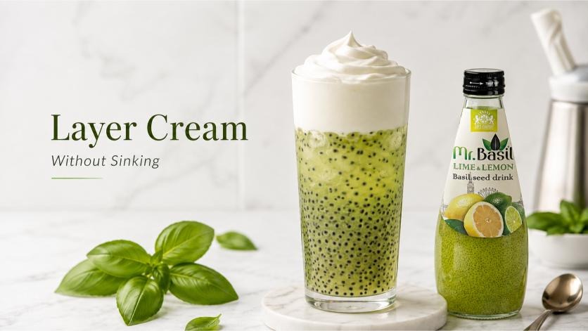 Layer cream without sinking on basil seed drink with lime and lemon bottle
