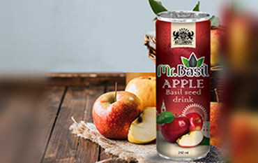 A can of Mr. Basil Apple flavored basil seed drink with fresh apples and apple slices on a rustic wooden background.